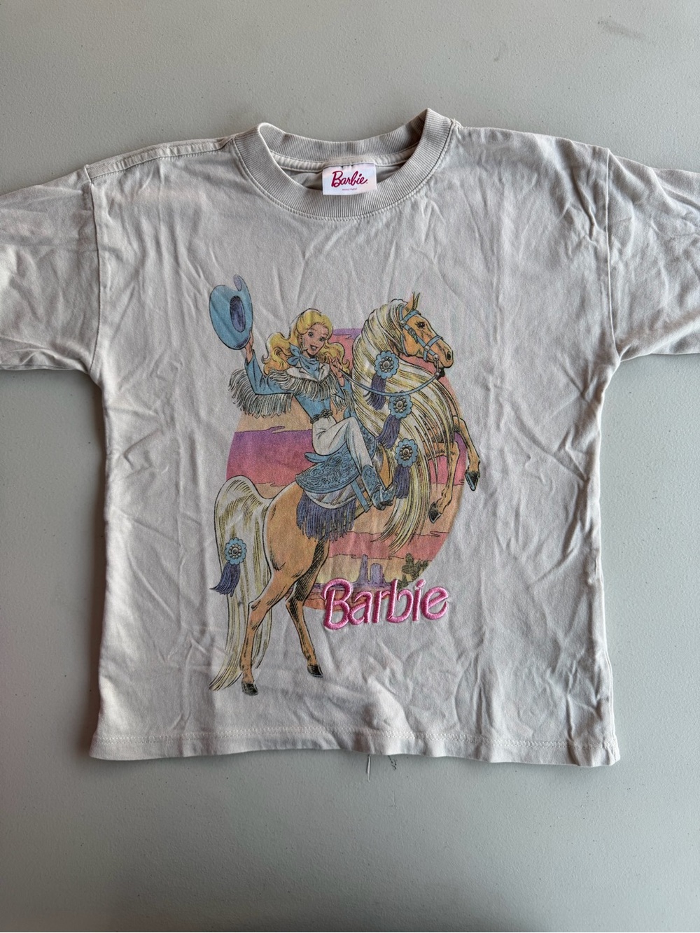 Cotton On Barbie Cream Tee with Pink Logo and Pastel Horse Graphic